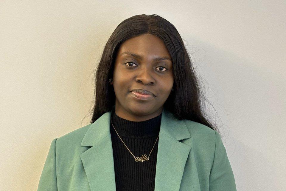 Maame Yaa Boakye, Class of 2020, in black shirt and green jacket.